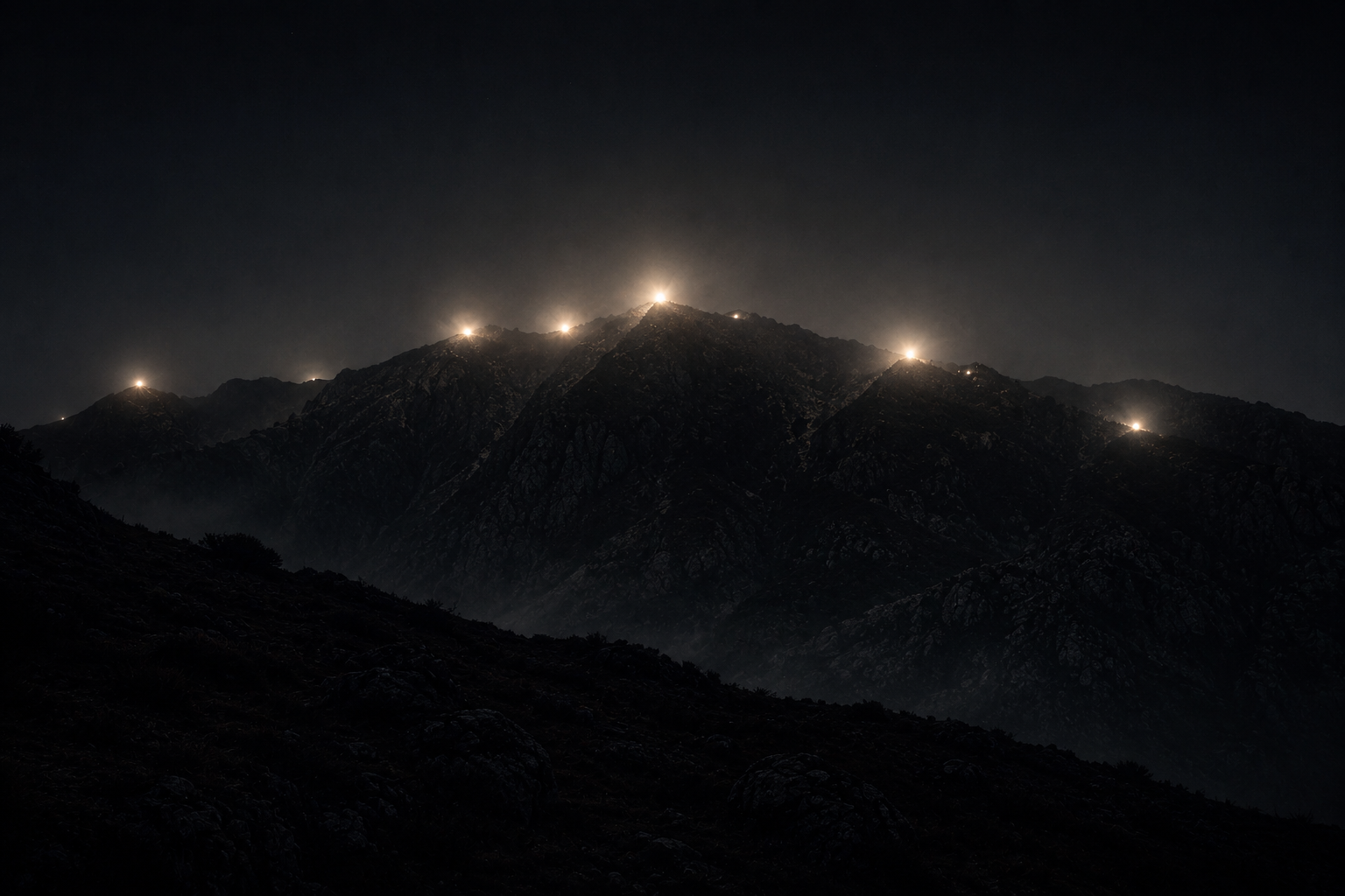 Lights over the mountains at night